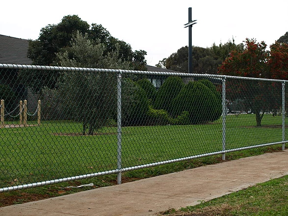 Metal net for stadium balls, chain link fence