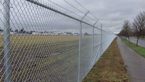 The chain link airport fence