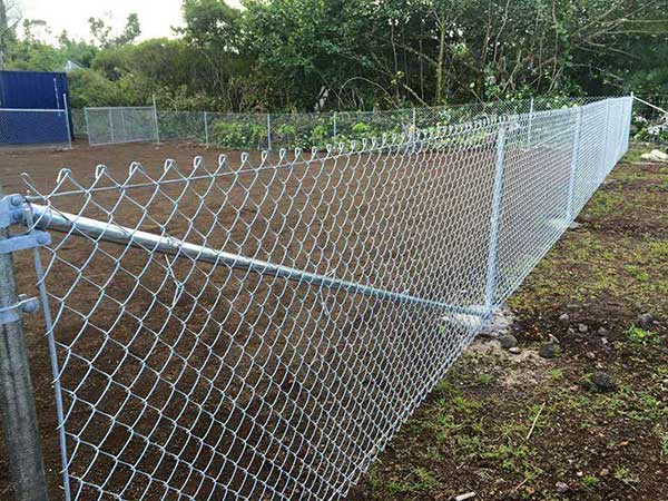 Chain link fence surface treatment