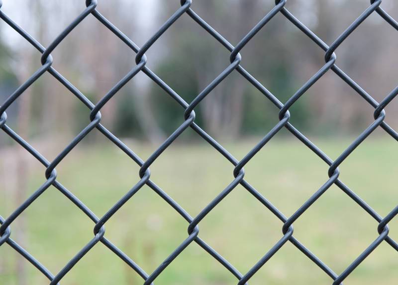 Anticorrosive treatment of chain link fence