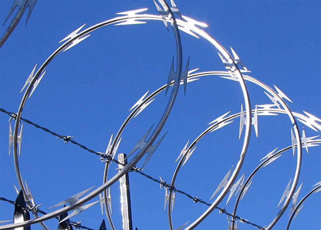 Installation of protective net and barbed wire